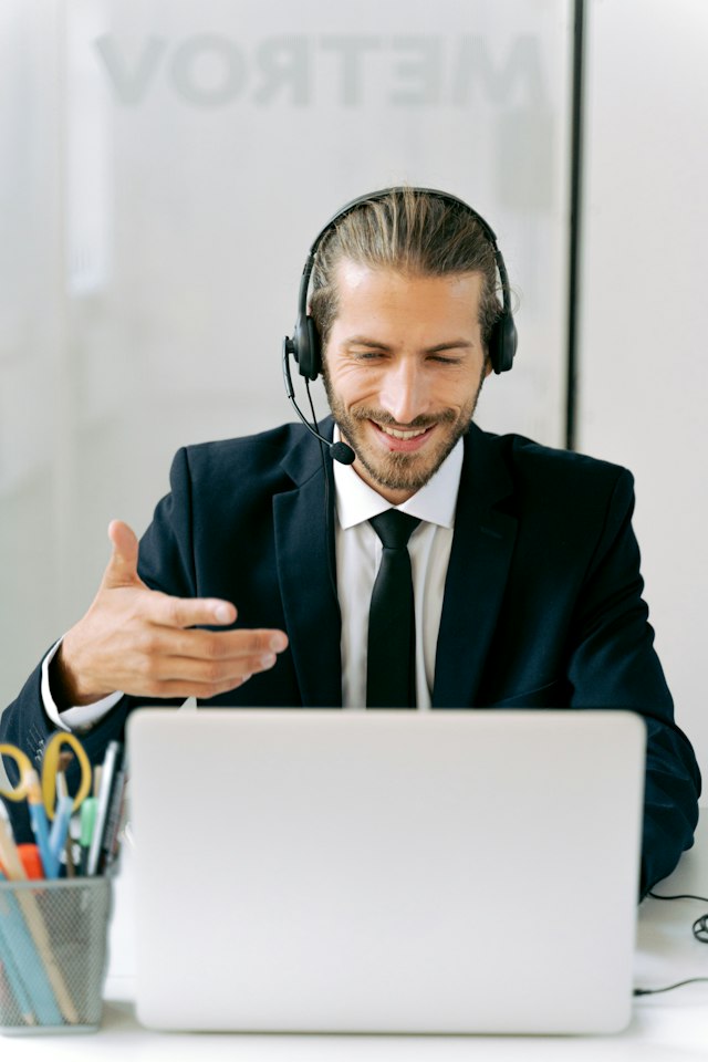 A translator speaking with a client over a webcam meeting.