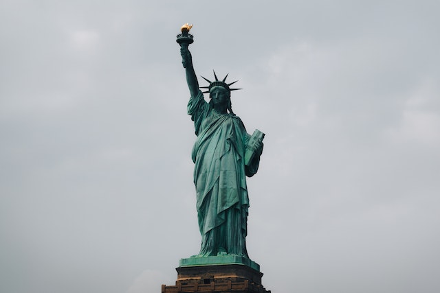 The Statue of Liberty against an overcast sky.