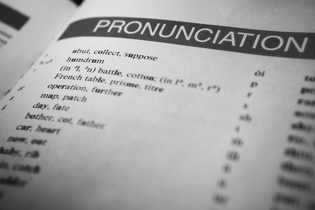 A foreign language textbook is open on a table. 