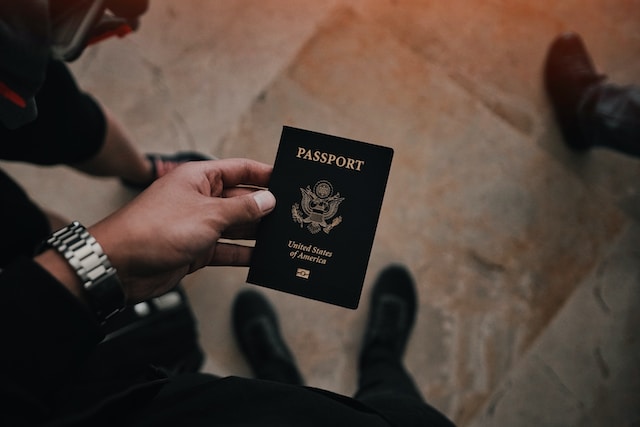 A picture of a person holding a United States Passport.