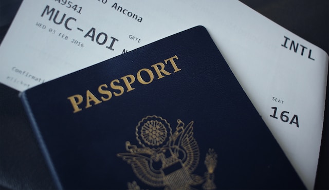 UKVI Translation: Get Your Papers Ready for UK Visa Success 5 A photo of a passport with a boarding pass sticking out of its pages.