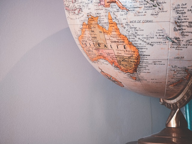 A photograph of a desk globe showing the Australian continent.
