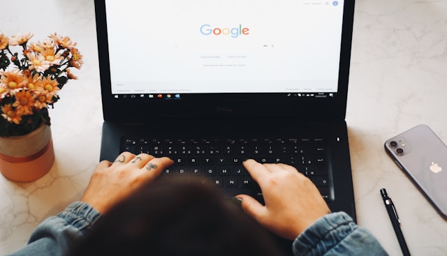 Best Translation Tool: The Key To Accurate Translations 7 A person types on a black laptop.