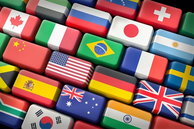 Different countries' flags are on the buttons of a computer keyboard.
