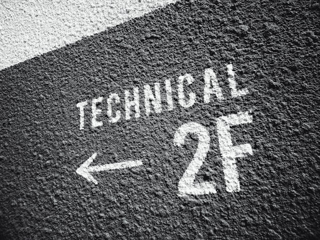 A dark wall with the words “TECHNICAL 2F” painted in white.