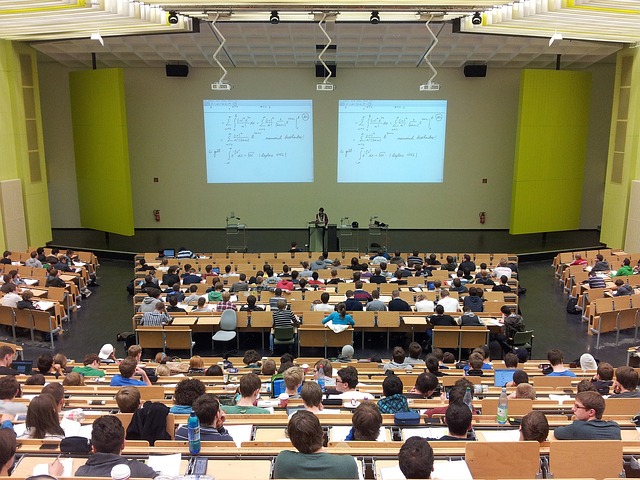 Students receive a lecture in a class.
