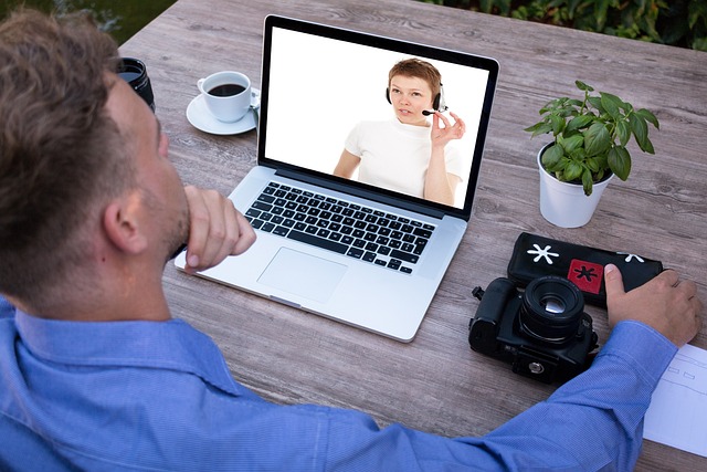 Two people on a virtual video meeting.
