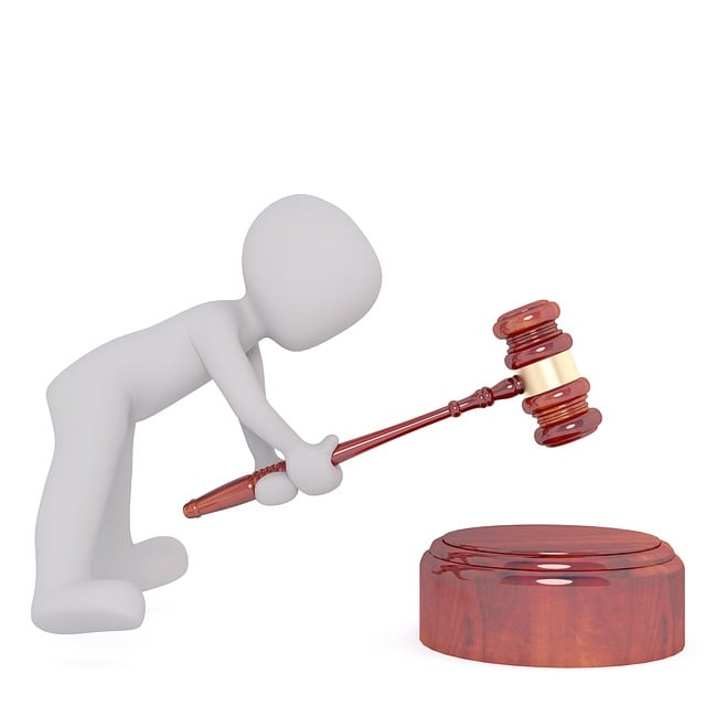  A person lifts a gavel.
