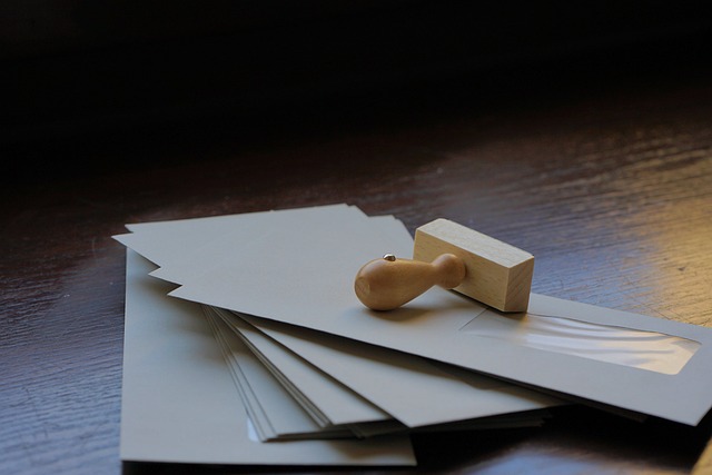 What Is a Certificate of Translation Accuracy? 5 A stamp and several envelopes on a wooden surface.