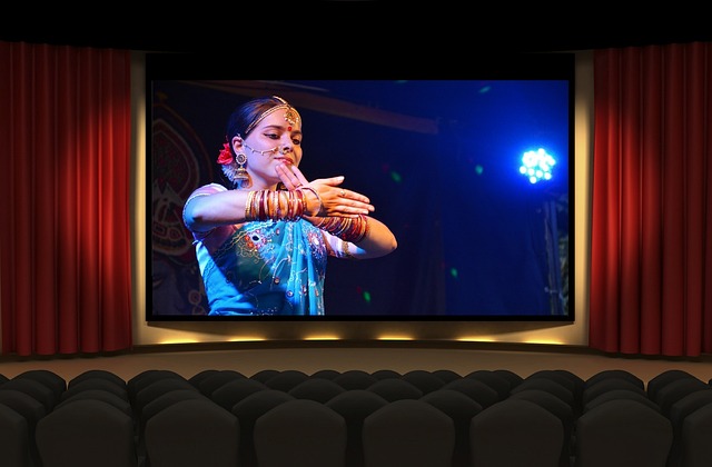 Movie Translator: The Best Tools To Use 3 A movie plays on a large screen in a cinema.
