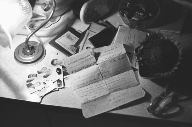 Can I Get a Birth Certificate Same Day? How Possible Is It? 4 A person’s personal documents and birth certificate on a table.