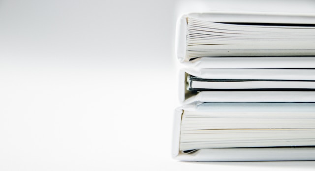 Is Studying Abroad Worth It 4 A close-up of a stack of three books with white covers.