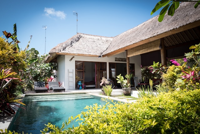 Easiest Countries To Buy Property as a Foreigner 6 A close-up of a house with a mini swimming pool and garden.